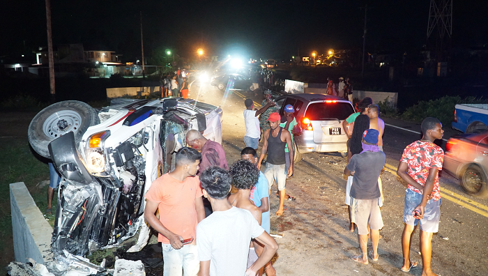 Three vehicle smash-up leaves occupants injured; unmasked spectators flock scene