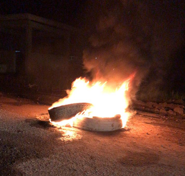Three arrested as Black Bush Poulder farmers burn tyres to protest flooding